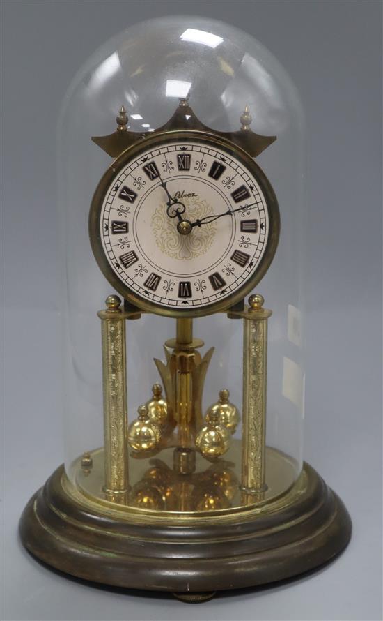 A brass 400 day clock under glass dome